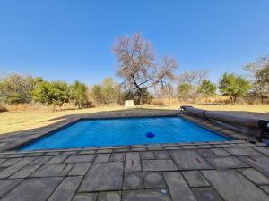 The swimming pool at or close to Zebula No 2 Waterbergs Over the Savannah 4 Bedroom