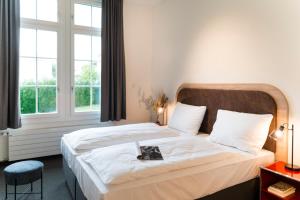 Letto o letti in una camera di KONCEPT HOTEL Löie