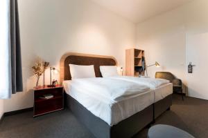 Letto o letti in una camera di KONCEPT HOTEL Löie