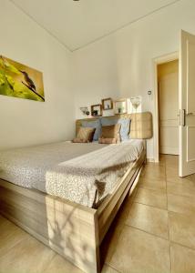 a bedroom with a large bed in a room at Nissaki Jonas Apartment in Nisaki