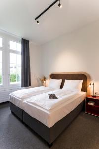 Letto o letti in una camera di KONCEPT HOTEL Löie