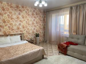 Giường trong phòng chung tại Апарт-отель ГОСТИ РУ