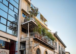 a building with balconies and plants on it at City Centre Studios in Limassol