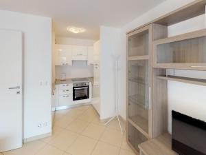 a kitchen with white cabinets and a stove at Appartement Menton, 2 pièces, 4 personnes - FR-1-196-200 in Menton