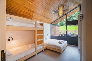 Postel nebo postele na pokoji v ubytování Gîte de la Tour - Dinant Evasion