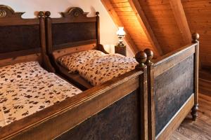 a bedroom with a bed in a log cabin at Ferienhaus Lilace in Böttingen +18 photos