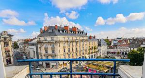 a view of a city from a balcony at B&B HOTEL Dijon Centre in Dijon