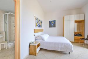 Ein Bett oder Betten in einem Zimmer der Unterkunft Joli Park Hotel - Caroli Hotels