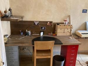 a wooden desk with a chair in a room at Great and light private room in the heart of Nice in Nice