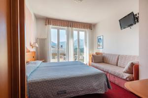 Voodi või voodid majutusasutuse Hotel Lucia toas