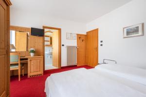 Voodi või voodid majutusasutuse Hotel Lucia toas