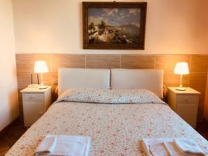 Ένα ή περισσότερα κρεβάτια σε δωμάτιο στο Villa Varenna