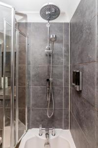 a bathroom with a shower and a sink at Modern Mews House with Free Parking Space, and Patio by Huluki Sussex Stays in Brighton & Hove