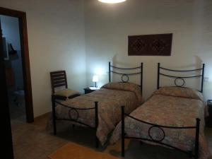 Postel nebo postele na pokoji v ubytování Agriturismo La Barca In Secca