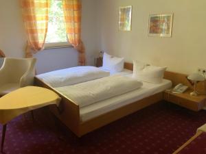 מיטה או מיטות בחדר ב-DAS LOFT Hotel Hölsterloh