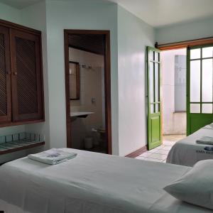 A bed or beds in a room at Hotel Terra Mater