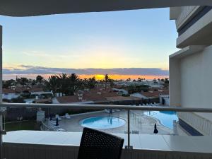 a view from a balcony of a resort with a swimming pool at Tamarán 311 in Playa del Ingles