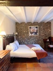 Postel nebo postele na pokoji v ubytování La Figuerola Hotel & Restaurant