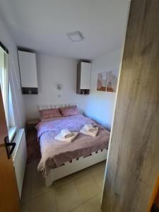 Katil atau katil-katil dalam bilik di Apartman Biljana