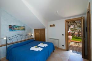 Postel nebo postele na pokoji v ubytování B&B Il Nespolo