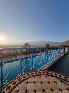 a view of the pool from the balcony of a hotel at L'oliveraie D'amizmiz in Amizmiz
