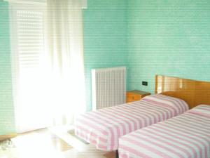 Katil atau katil-katil dalam bilik di Albergo Drena
