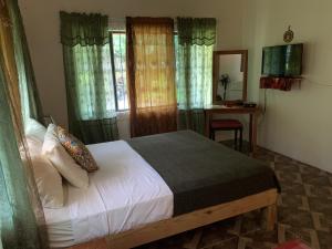 Ένα ή περισσότερα κρεβάτια σε δωμάτιο στο Can Jam Retreat