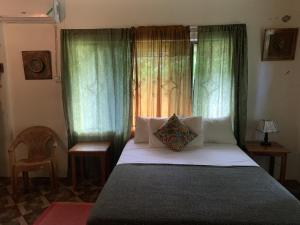 Ένα ή περισσότερα κρεβάτια σε δωμάτιο στο Can Jam Retreat