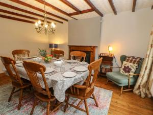 a dining room with a table and chairs at West View in Ripon