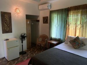 Ένα ή περισσότερα κρεβάτια σε δωμάτιο στο Can Jam Retreat