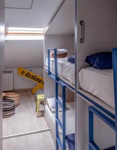 a room with two bunk beds and a mirror at Santiago KM-0 in Santiago de Compostela