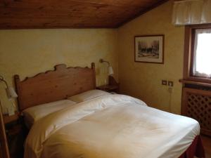 Postel nebo postele na pokoji v ubytování Meuble Villa Neve