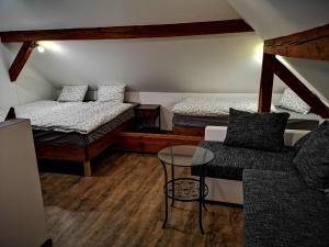 Postel nebo postele na pokoji v ubytování Dráchovský apartmán a vejminek