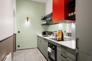 Η κουζίνα ή μικρή κουζίνα στο Edgar Suites Notre-Dame - Lagrange