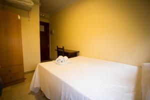 Postel nebo postele na pokoji v ubytování Hostal Bocanegra