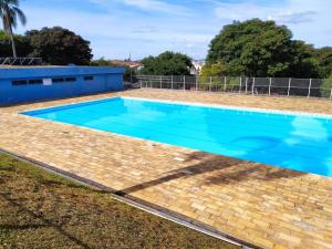 Bazén v ubytování Pousada Clube Universo Esportivo nebo v jeho okolí