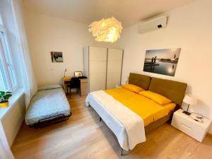 Posteľ alebo postele v izbe v ubytovaní Residence Neverin Trieste