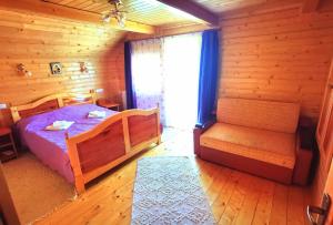 a bedroom with a bed and a window in a cabin at Cabanele FloriCrin - Cabana 1 in Cluj-Napoca