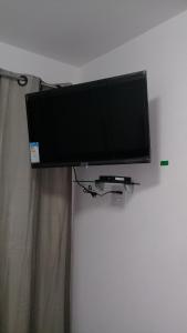 TV a/nebo společenská místnost v ubytování Flat Smart 401-Frente a praia-com self-check-in.