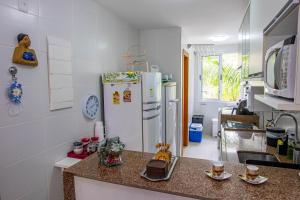 A cozinha ou kitchenette de Village Enseada Ville, Itacimirim, Bahia