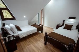 Un pat sau paturi într-o cameră la Vila ZLATARSKA PAHULJA