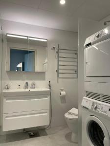 Ванная комната в Ainoa Shopping Center Apartments - Tapiola