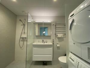Ванная комната в Ainoa Shopping Center Apartments - Tapiola