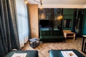Ένα ή περισσότερα κρεβάτια σε δωμάτιο στο Apartamenty Wysoki Poziom