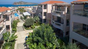 an aerial view of a city with buildings and the ocean at Isida Hotel Agia Marina in Agia Marina Nea Kydonias