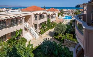arial view of a villa with the ocean in the background at Isida Hotel Agia Marina in Agia Marina Nea Kydonias