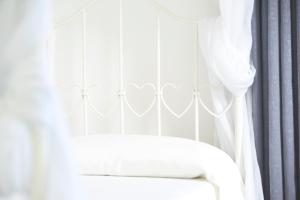 Ένα ή περισσότερα κρεβάτια σε δωμάτιο στο B&B The Divine