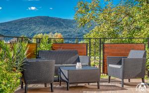 a group of chairs and a table on a patio at Agroturystyka Corno Owca in Żabnica