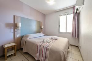 Postel nebo postele na pokoji v ubytování Résidence Pierre & Vacances La Rostagne + 28 fotografií