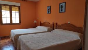 Łóżko lub łóżka w pokoju w obiekcie El encinar de las Hoces - Vivienda de uso turístico